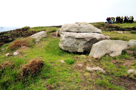 One of the Boscregan cairns, just down the coast from Ballowall. This is a propped stone inside a cairn setting. The Scillies are prominent from here. That's a group of dowsers and archaeologists behind.