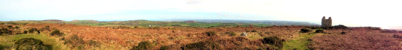 Castle an Dinas, a sacred enclosure. On the horizon, centre, Trencrom Hill, then leftwards Trink Hill, Rosewall Hill and Zennor Hill.