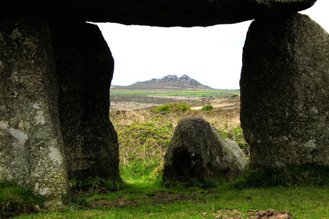 Lanyon Quoit with neolithic tor Carn Galva behind